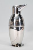 A novelty silver plated cocktail shaker in the form of a penguin wearing a bow tie. Measures 20cm