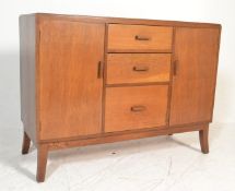 A mid 20th Century oak sideboard credenza having a central bank of three graduating drawers
