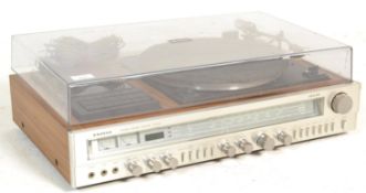 A vintage Sanyo G3003 solid state stereo music centre hifi having a teak wood casing with smokey