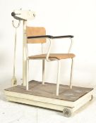 A set of vintage Industrial East German cold war era medical manual weighing scales, the scales