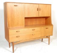 Brasilia - A retro 20th Century teak wood G-Plan highboard sideboard credenza, being raised on
