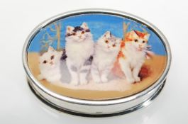 A sterling silver pill box of oval form having an enamelled lid with pictorial image depicting cats.