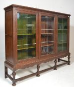 An early 20th Century large oak  Edwardian  triple library bookcase on stand. The bookcase with