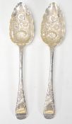 Two early 19th Century George III Sarah and John Blake silver hallmarked  berry spoons having