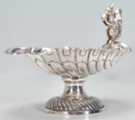 A 20th Century WMF silverplate half shell tazza raised on circular base having a moulded squirrel