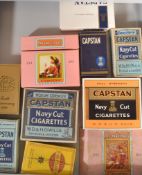 A collection of 20th Century Cigarette packets stored within a Bisley cabinet. Packets include W. D.