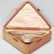 A silver hallmarked three piece Christening set within its original leather case of triangular form,