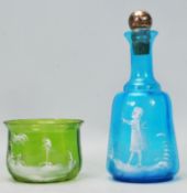 A 19th Century blue glass decanter in the manor of Mary Gregory having hand decorated scene