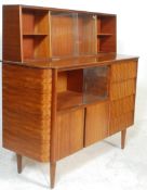 A vintage / retro 20th Century highboard / sideboard / credenza, having a run four beehive drawers