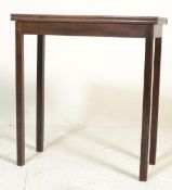 A George III 18th Century mahogany tea table being raised on squared legs with fitted frieze