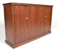 A Victorian 19th century stained pine church vestry cabinet cupboard raised on a plinth base with
