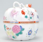 A Chinese export porcelain pumpkin lidded vase decorated in famille rose decoration with embellished