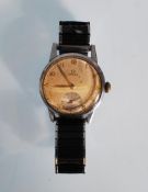 A vintage 1940's / 50's Omega gentleman's wrist watch having a stainless steel case, round face,