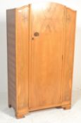 An early 20th Century walnut  bachelors single wardrobe compactum, single door to front opening to