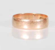 An English hallmarked 9ct yellow gold wedding band. Hallmarked for 375 for Birmingham date letter