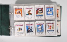 An album of 20th Century Whitbread's Inn Signs trade card sets to include London, Kent, Isle Of