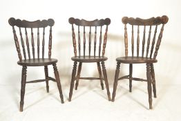 A set of three vintage 20th Century  bistro / dining chairs, shaped back rest over turned spindle