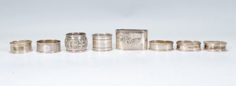 A collection of silver napkin rings to include a selection of Henry Griffith & Sons rings; a