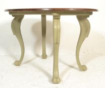 A Victorian 19th century mahogany shabby chic painted dining / centre table. The large cabriole legs