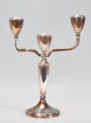 A 20th Century Bishton's silver hallmarked candelabra raised on a round base with a tapering