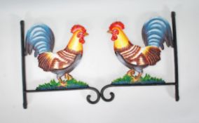 Two cast iron wall hangers / brackets having in the form of cockerels having coloured painted