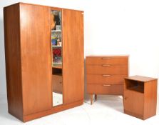 A retro 20th Century teak wood Austin Suite bedroom suite comprising of a chest of drawers, double