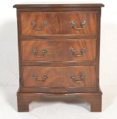A 20th Century mahogany Regency revival chest of drawers, the serpentine chest of three drawers