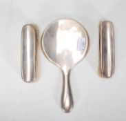 A silver hallmarked early 20th century vanity handheld mirror together with a pair of silver