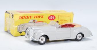 A vintage Dinky Toys Diecast Bentley Coupe S2 toy model car no.194 complete with original box.
