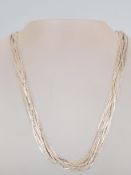 A stamped 925 silver multi chain necklace by Milor having a toggle clasp. Measures 19.5 inches.