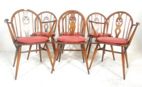 Lucian Ercolani - A set of six Ercol mid Century Old Colonial dining chairs of dark beech and elm