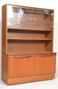 A retro  20th century teak wood mid century highboard - credenza having a plinth base with double
