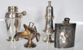 A small group of silver plate items to include a vintage cocktail shaker, sugar shaker, hip flask of