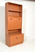 A vintage retro mid 20th Century G Plan red label teak wood wall unit consisting of twin door
