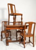 An early 20th Century Art Deco oak draw leaf dining table, the table supported on bulbous carved