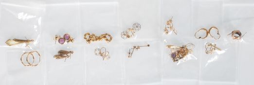 A group of twelve pairs of 9ct gold earrings of varying sizes and styles. Earrings include drop