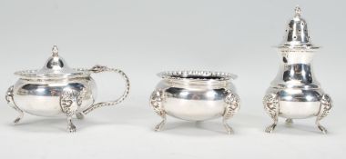 A set of three Georgian style silver plate condiments consisting of pepperette, table salt and
