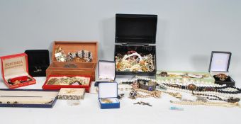 A good collection of vintage costume jewellery to include bangles, bracelets, necklaces with stone