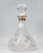 A 20th Century cut glass ships decanter of tapering form having a Mappin and Webb silver