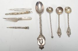 A selection of 20th Century silver items to include a silver hallmarked trowel bookmark having a