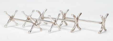 A collection of late 20th Century Silver Hallmarked knife rests to include: a pair of knife rests by