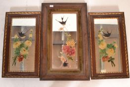 A pair of early 20th century oak framed ' Gypsy ' mirrors each with painted rose and ribbon