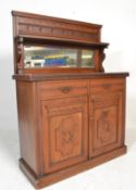 A 19th century Victorian rosewood chiffonier with raised mirror back above two cupboard doors raised