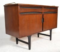 A 1950's retro vintage teak wood and ebony flashed sideboard credenza of small proportions having