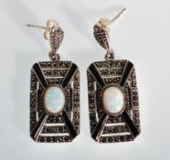 A pair of Art Deco style silver and marcasite earrings having central opal cabochons with slender