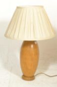 A 20th century hand turned retro wooden table lamp, possibly laburnum wood being of bulbous form