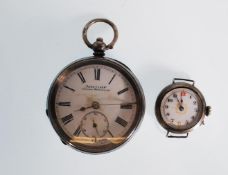 A silver open face pocket watch having a white enamel face with Roman numeral chapter ring with
