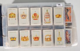A collection of vintage 20th Century Godfrey Phillips cigarette trade cards in full sets stored