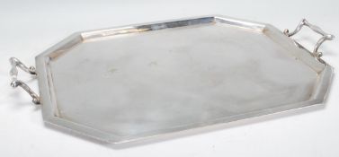 A 20th Century silverplate tray of oblong octagonal form having Art Nouveau style handles. Stamped