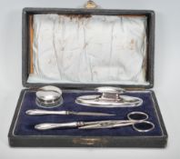 An early 20th Century silver hallmarked five piece manicure cased set, assay mark for Birmingham